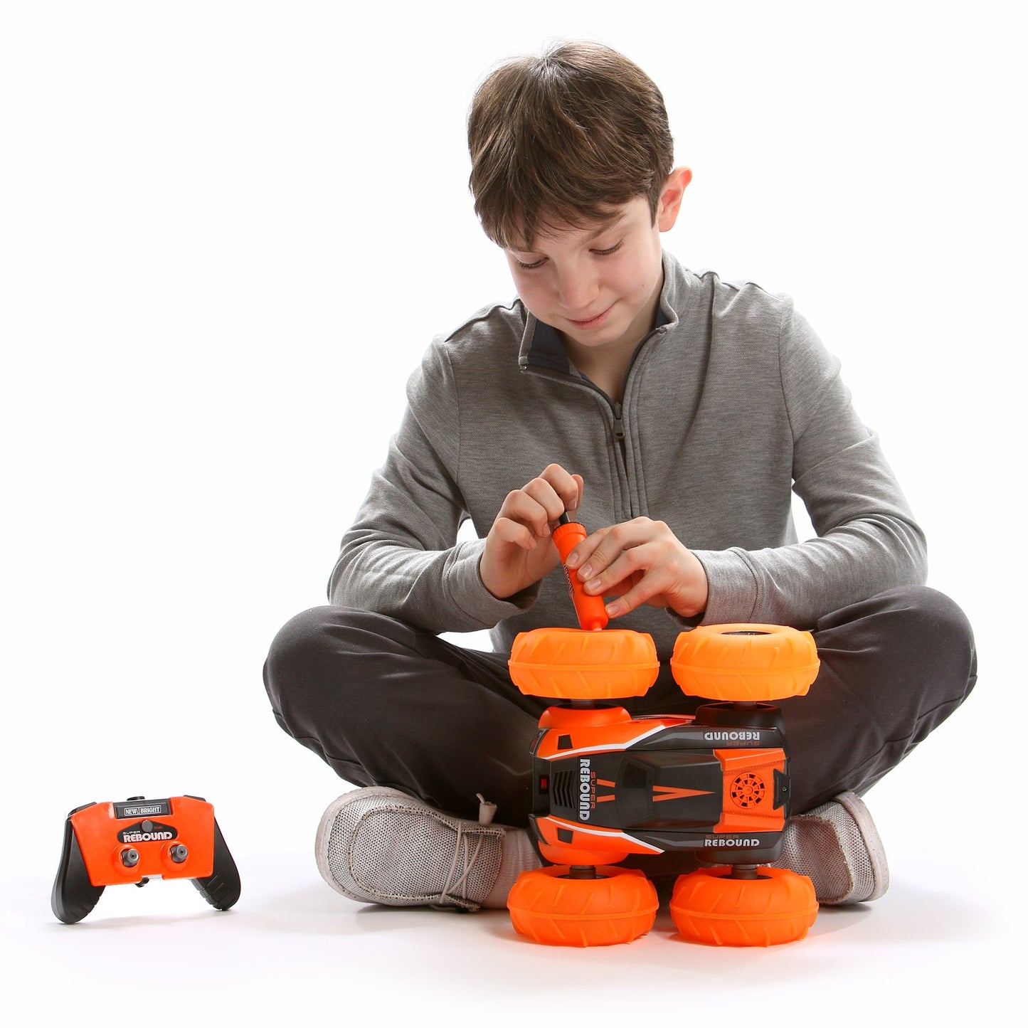 New Bright (1:16) Super Rebound Battery Remote Control Orange Stunt Vehicle, Children, Tweens, 1663U