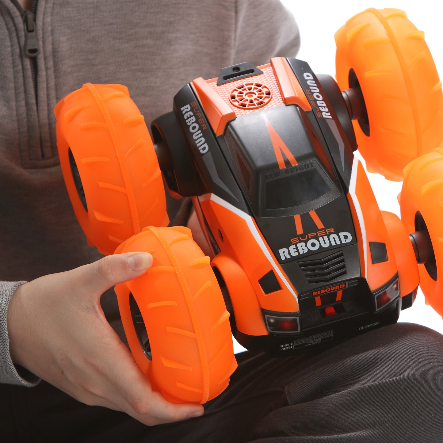 New Bright (1:16) Super Rebound Battery Remote Control Orange Stunt Vehicle, Children, Tweens, 1663U